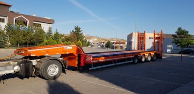 GT LOWBED SEMI TRAILERS which is knows also low loader and can carry heavy loads , excavators , construction machines, transformer, generator , cranes , caravans , army tanks and different kind of big machines. Lowbed Semi Trailers can be produced between 2 axles to 8 axles and loading capacity starting from 20 Tons to 180 Tons , rear or front loading Lowbed Trailers and platform as customer demand with different kind of specification according to demand. Self steering axles, hydraulic auto remote control axles, pool type chassis, Low bed Trailers hydraulic ramp, platform type chassis can be used in different kind of Low bed trailer